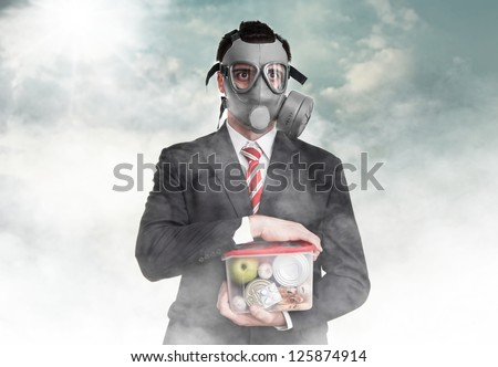 Business man with gas mask holding nutrition, survival concept