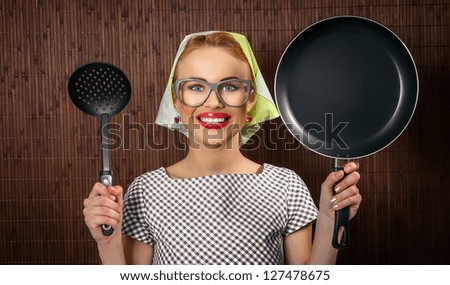 Close-up woman cook with pan and spoon - vintage concept