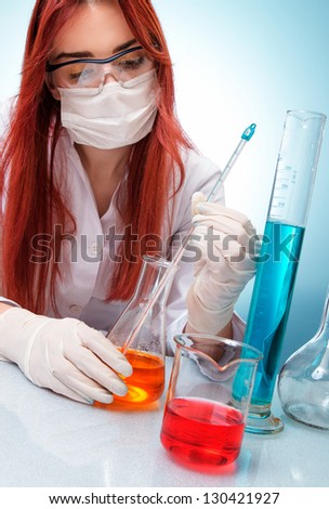 Chemist woman with test tubes and thermometer