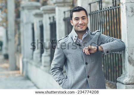 Young attractive man posing, outdoor - outsides. Good looking turkish guy