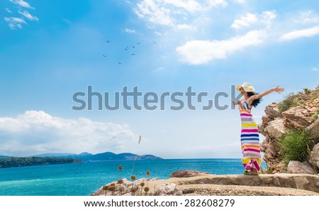 Carefree  woman profile breathing deep fresh air in summer on the beach. Copy space - copyspace. Girl with open arms. Freedom - wellbeing