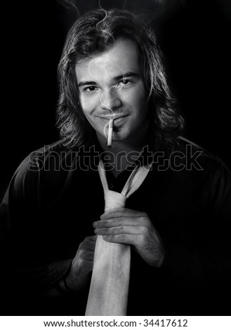 Young lucky man with cigar and astringe cravat