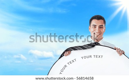 Young happy businessman hold rounded white border, space for your text