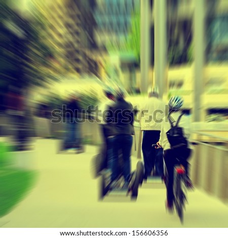 Motion blurred with several people moving over a modern omnidirectional personal transport platform