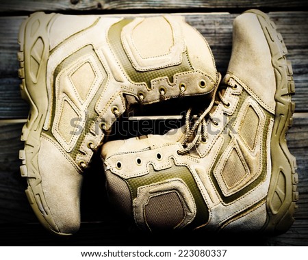 Hiking boots with wooden background
