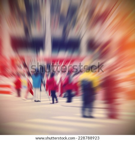 People walking at Thanksgiving Day Parade, blur motion