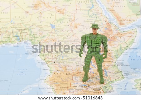 toy soldier on world map