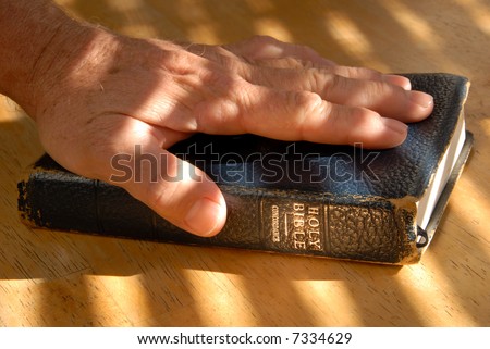 Left Hand On Bible For Testimonial Oath, Under Dramatic Light