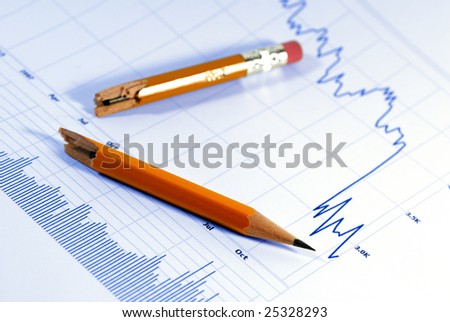 Financial chart, market's falling, broken pencil suggests fallen spirits