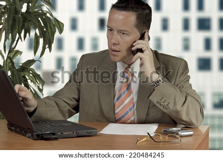 Office worker on phone at office
