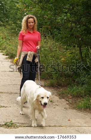 Girl with dog on dog-lead