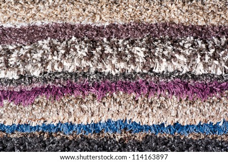 pile of carpets of different colors