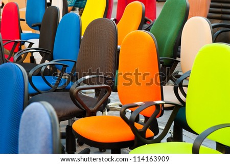 group of multi colored office chairs