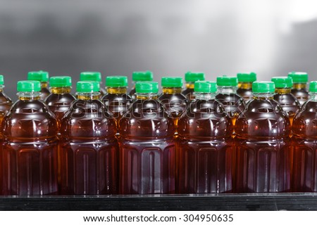 bottles of juice on production line