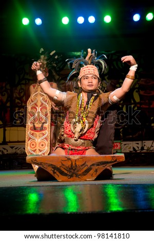 KUCHING, SARAWAK, MALAYSIA - FEB 25 : The Iban Warrior perform the ngajat (tribal dance) at the Sarawak Cultural Village on February 25, 2012 in Santubong, Sarawak.