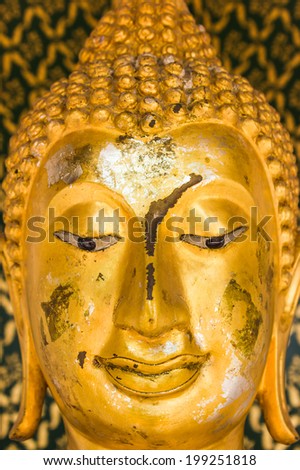 old gold buddha statue face.