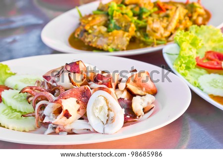 Grilled octopus is sliced ??on a plate ready to eat.