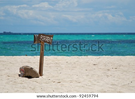 For rent sign on the white sand beach blue sea nice cloud