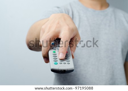 Hand pointing remote control in front