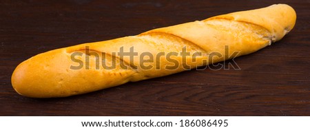 French bread on a dark wooden background