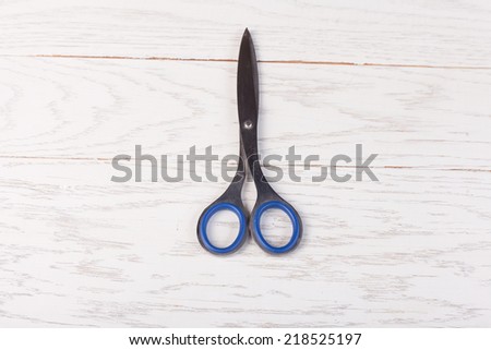 Scissors on wood table