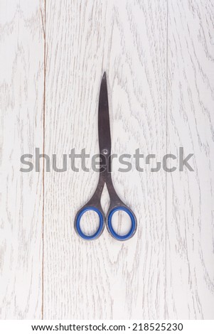 Scissors on wood table