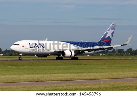 AMSTERDAM - JULY 02: LAN Airlines Cargo Boeing 767 lands at AMS Airport in Netherlands on July 02, 2012. LAN is a group of South American Airlines based in Santiago..