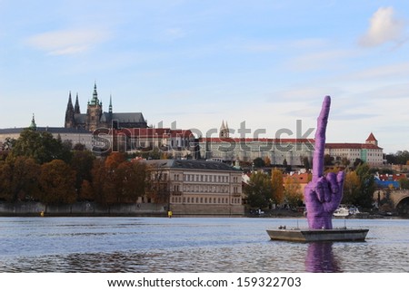 PRAGUE - OCTOBER 21: Artist David Cerny has floated a huge purple statue of an extended middle finger down the River Vltava on October 21, 2013 in Prague.