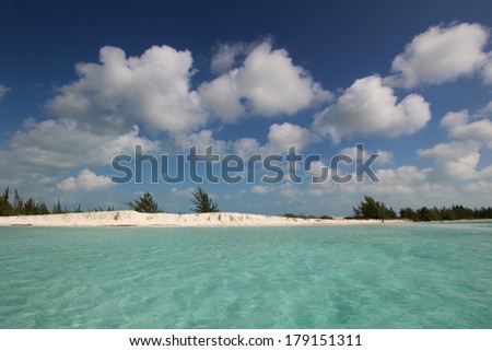 View of the beautiful clean ocean on the coast with a sky full of clouds
