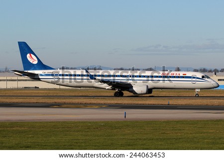 PRAGUE, CZECH REPUBLIC - JANUARY 13: Belavia Embraer 195LR taxis to take off from PRG Airport on January 13, 2015. Belavia is the national airline company of Belarus