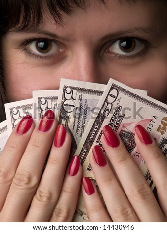 Young woman with dollars as feather happy winner