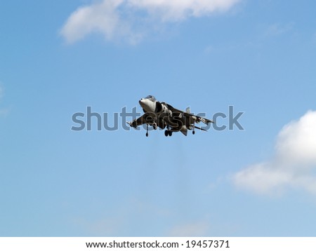 Harrier hovering high in the sky gear down