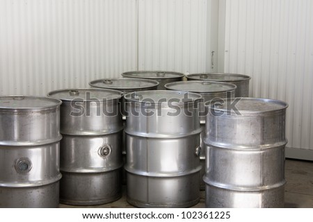 Industrial steel drums in an industrial warehouse