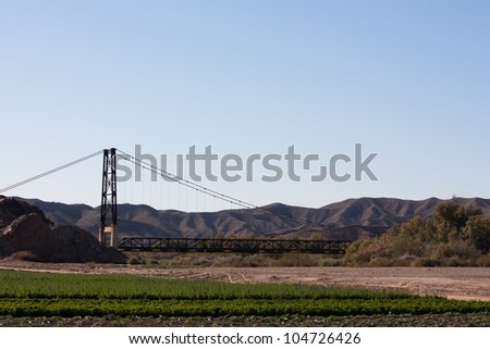 Suspension bridge in the desert.  The 