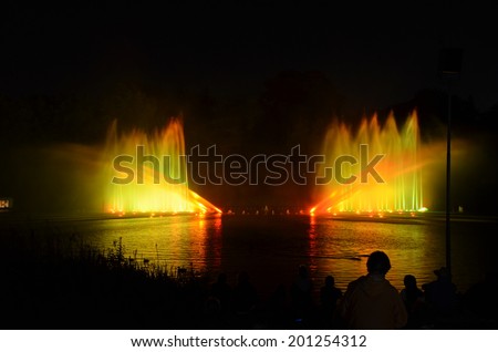 illuminated water games  colored waterfountains bright lights and music