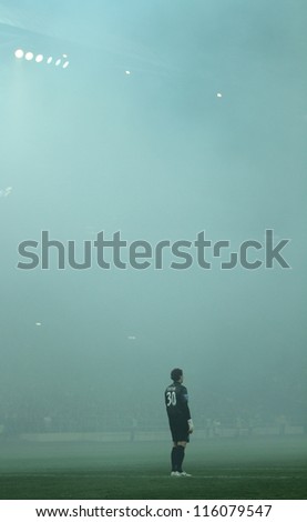 KHARKIV, UKRAINE - OCTOBER 7: FC Shakhtar Donetsk GK Andriy Pyatov in dense smoke during football match vs FC Metalist Kharkiv, October 7, 2012 in Kharkov, Ukraine