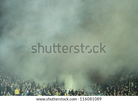 KHARKIV, UKRAINE - OCTOBER 7: FC Metalist Kharkiv fans use smoke bombs during football match vs FC Shakhtar Donetsk, October 7, 2012 in Kharkov, Ukraine