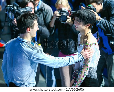 Sochi, RUSSIA - February 14, 2014: Patrick CHAN (L) and Yuzuru HANYU (R)greet each other before Men Free skating in-venue flower ceremony at Sochi 2014 XXII Olympic Winter Games