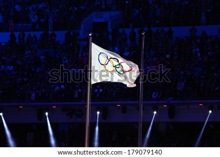 Sochi, RUSSIA - February 23, 2014: Olympic flag at closing ceremony in Fisht Olympic Stadium at the Sochi 2014 Olympic Games