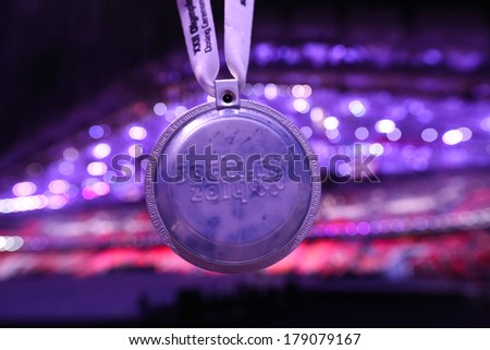Sochi, RUSSIA - February 23, 2014: Spectator medal at closing Ceremony in Fisht Olympic Stadium at the Sochi 2014 Olympic Games