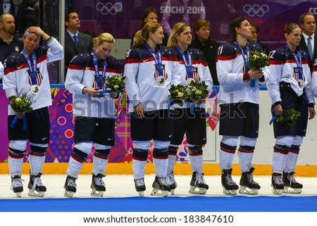 Sochi, RUSSIA - February 20, 2014: USA Women\'s Ice hockey team silver medalists, at medal ceremony after Gold Medal Game vs. Canada team at the Sochi 2014 Olympic Games
