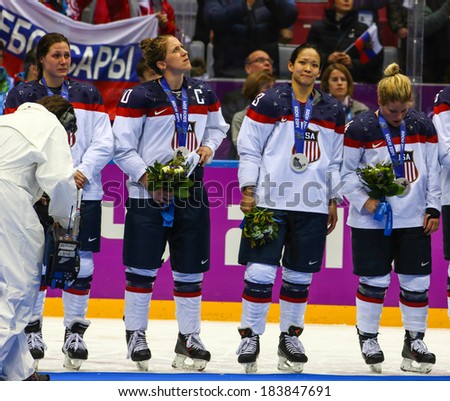 Sochi, RUSSIA - February 20, 2014: USA Women\'s Ice hockey team silver medalists, at medal ceremony after Gold Medal Game vs. Canada team at the Sochi 2014 Olympic Games