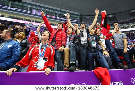 Sochi, RUSSIA - February 20, 2014: Fans of Canadian Women\'s Ice hockey team celebrates their team victory in Gold Medal Game vs. USA team at the Sochi 2014 Olympic Games