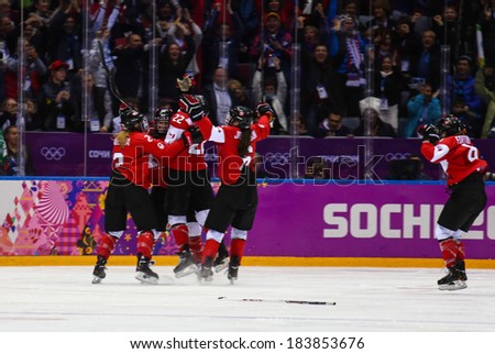 Sochi, RUSSIA - February 20, 2014: Canadian Women's Ice hockey team celebrating gold medals, after Gold Medal Game vs. USA team at the Sochi 2014 Olympic Games