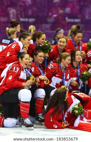 Sochi, RUSSIA - February 20, 2014: Canadian Women\'s Ice hockey team gold medalists, at medal ceremony after Gold Medal Game vs. USA team at the Sochi 2014 Olympic Games