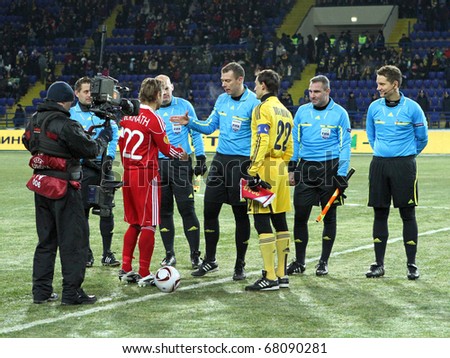 KHARKIV, UKRAINE - DECEMBER 1: Coin toss at Group stage UEFA Europe League Metalist Kharkiv vs. Debreceni VSC football match (2:1), December 1, 2010 in Kharkov, Ukraine