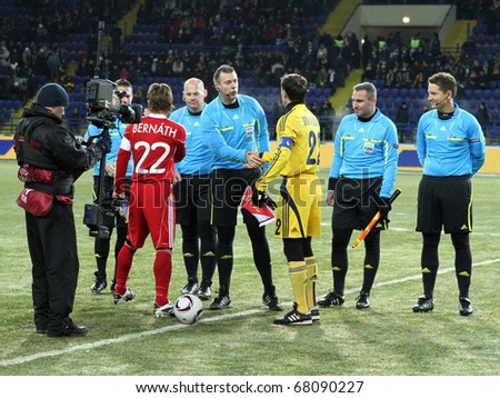 KHARKIV, UKRAINE - DECEMBER 1: Coin toss at Group stage UEFA Europe League Metalist Kharkiv vs. Debreceni VSC football match (2:1), December 1, 2010 in Kharkov, Ukraine