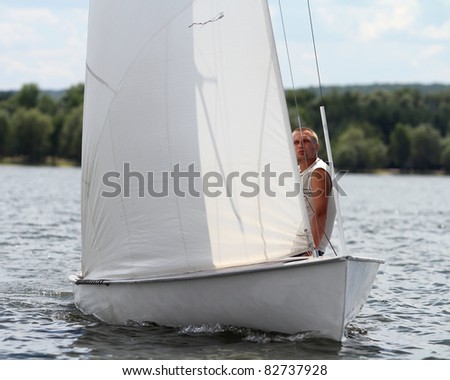STARY SALTOV,UA - AUGUST 6: Class Flying Dutchman sailing boats unidentified participants compete during Slobozhanshina Sailing Cup. August 6, 2011 in Stary Saltov, Ukraine
