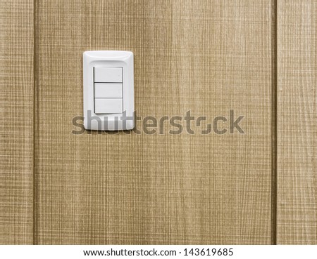 Electrical switches on wooden wall