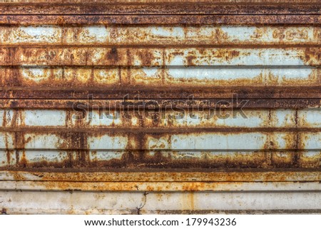 Rusty metallic gate in factory